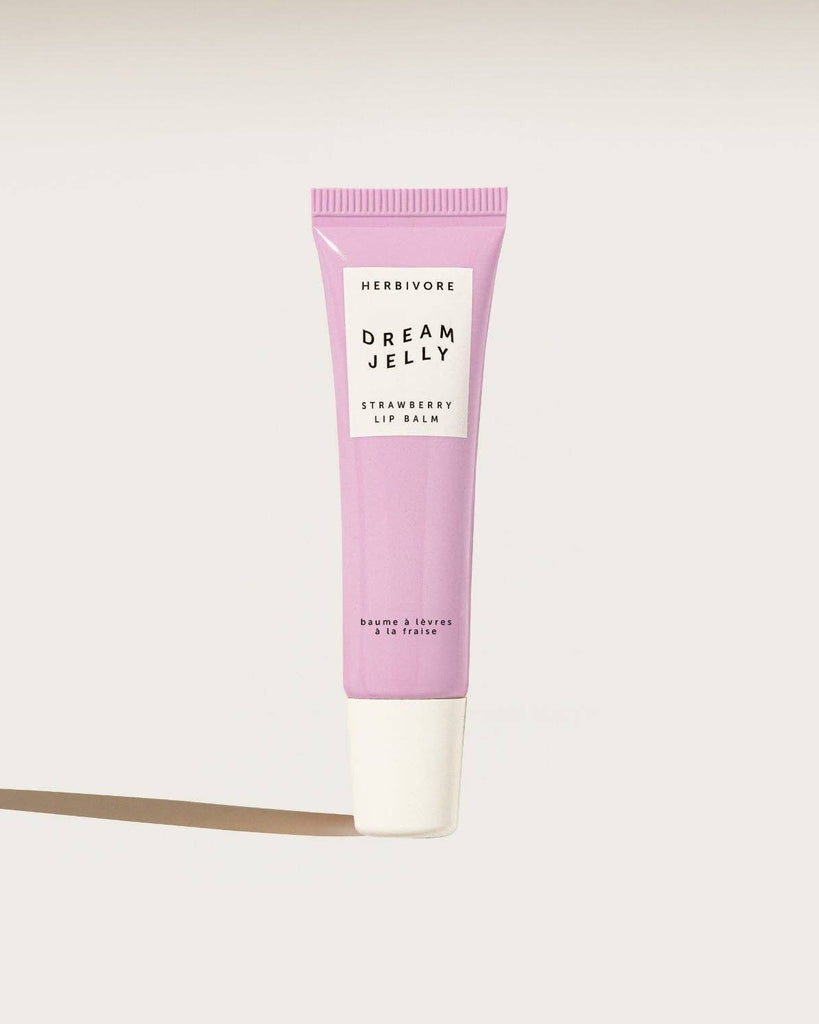 Pink lip balm tube labeled 'Dream Jelly' on a white background