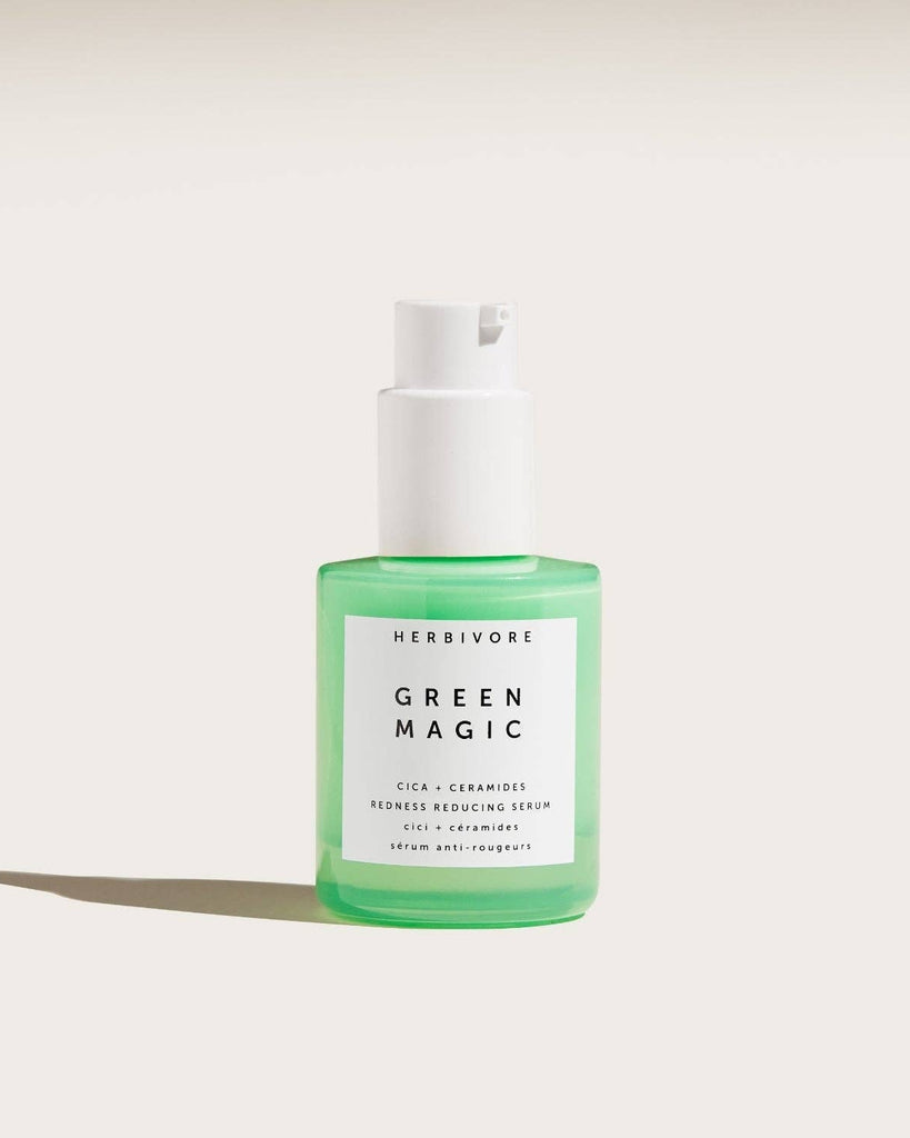 Bottle of Herbivore Green Magic serum on a white background